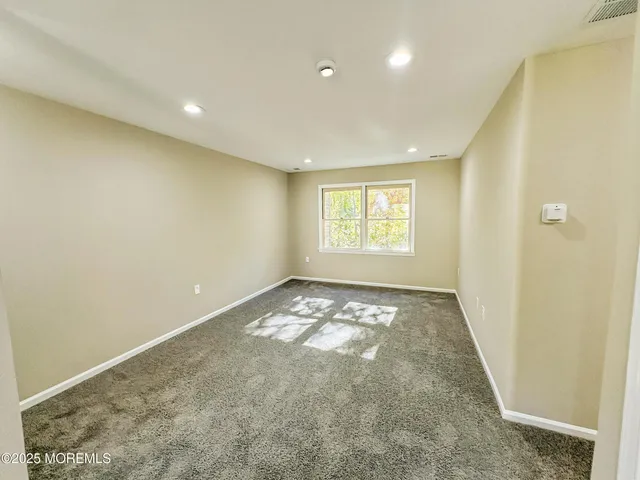 a kitchen with stainless steel appliances a stove top oven sink and window