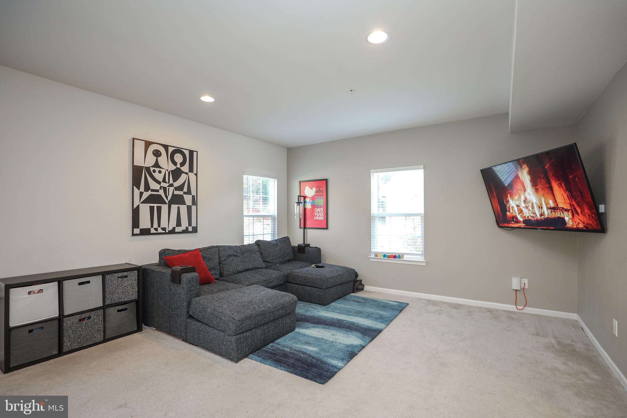 1024 Cook Drive Southeast Washington, DC 20032 - Photo 1 of 44 a living room with furniture and a flat screen tv