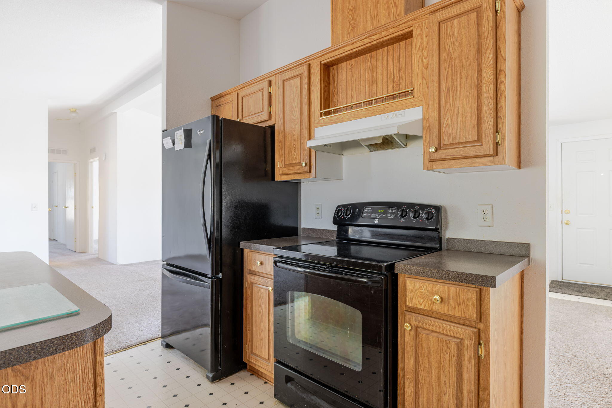 8628 Southwest Crater Loop Road Terrebonne, OR 97760 - Photo 16 of 36 a kitchen with stainless steel appliances granite countertop a stove a refrigerator and a sink