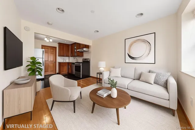a living room with fireplace furniture and a flat screen tv