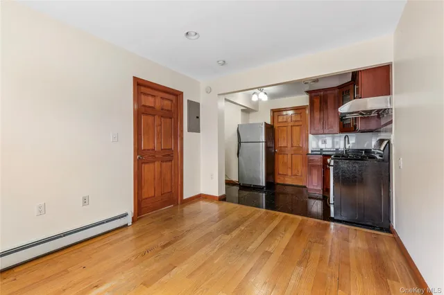 a kitchen with stainless steel appliances a refrigerator and a stove top oven
