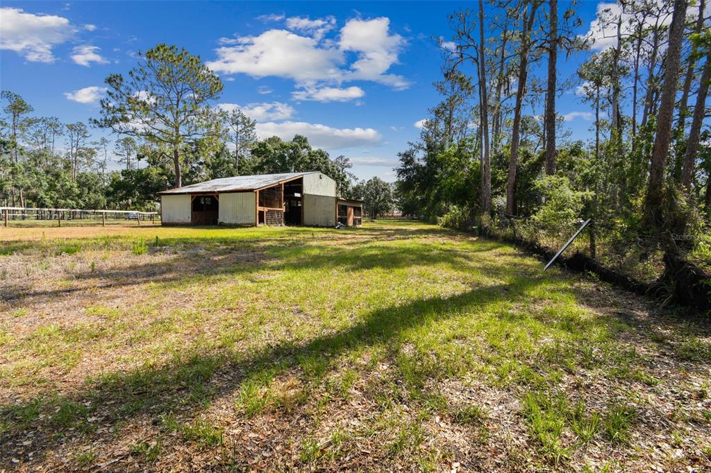 2853 Saffold Road Wimauma, FL 33598 - Photo 12 of 62 a view of an house with pool and yard