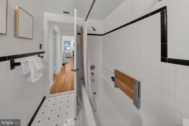 a bathroom with a sink and shower