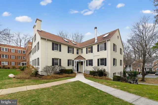 a front view of a house with a yard table and chairs