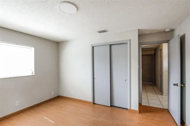 an empty room with closet area