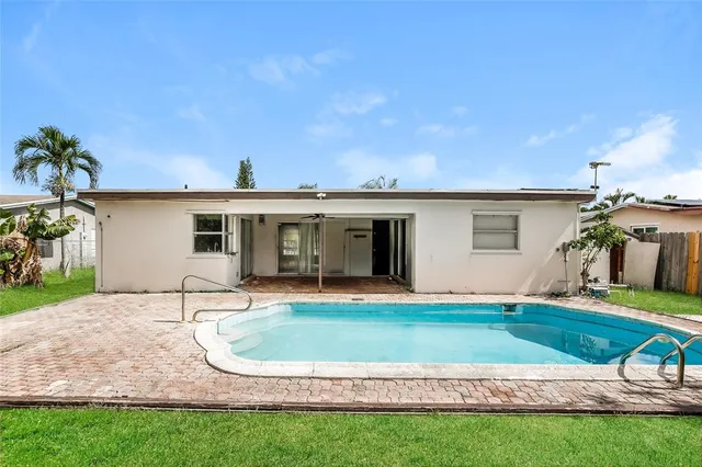 a view of a house with a yard porch and sitting area