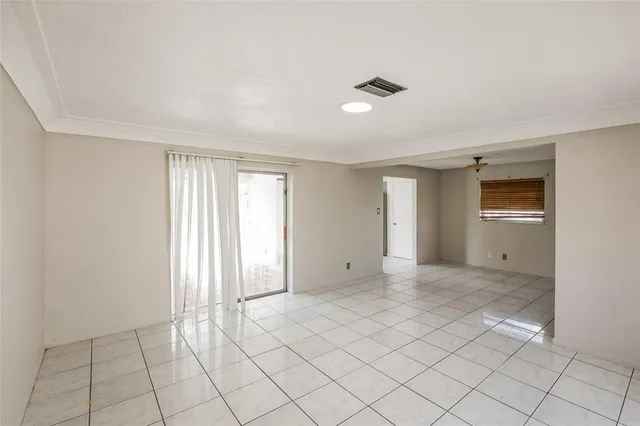 a view of an empty room and window