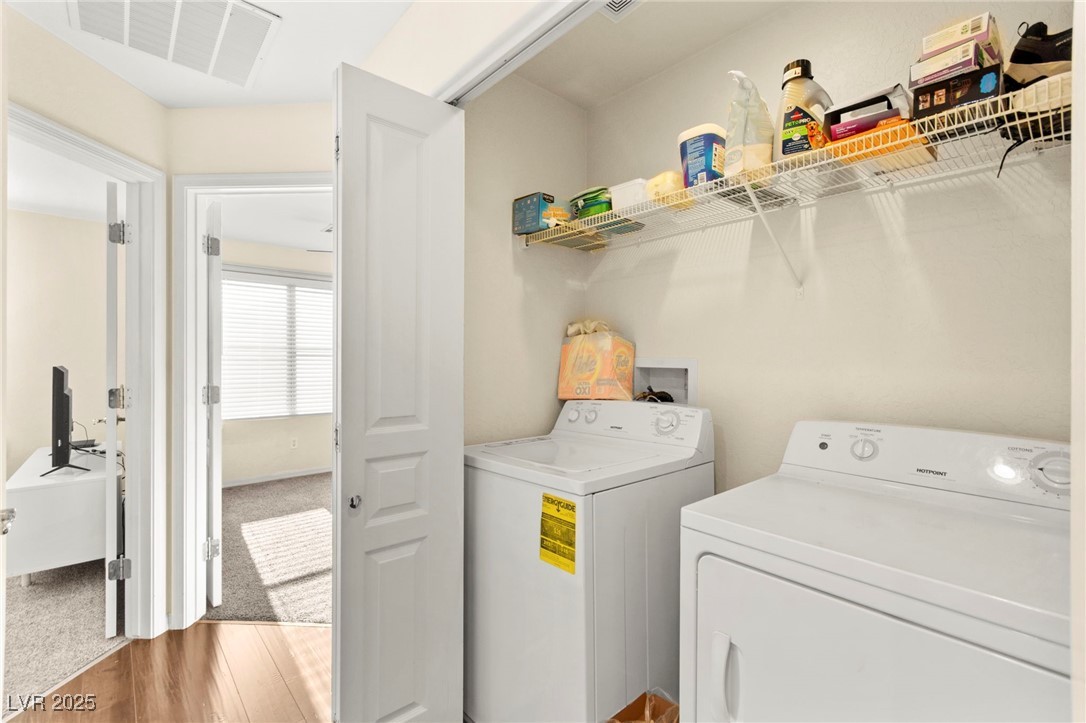 4650 Ranch House Road, Unit 143 North Las Vegas, NV 89031 - Photo 53 of 54 Laundry room featuring washer and dryer and light wood finished floors