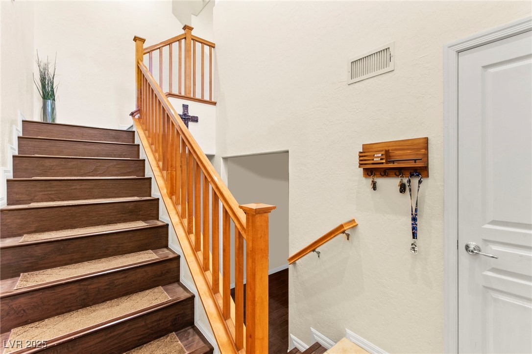 4650 Ranch House Road, Unit 143 North Las Vegas, NV 89031 - Photo 8 of 54 Stairs featuring wood finished floors and baseboards