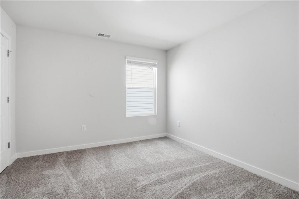 5351 Tolar Road South Fulton, GA 30213 - Photo 18 of 30 an empty room with a window