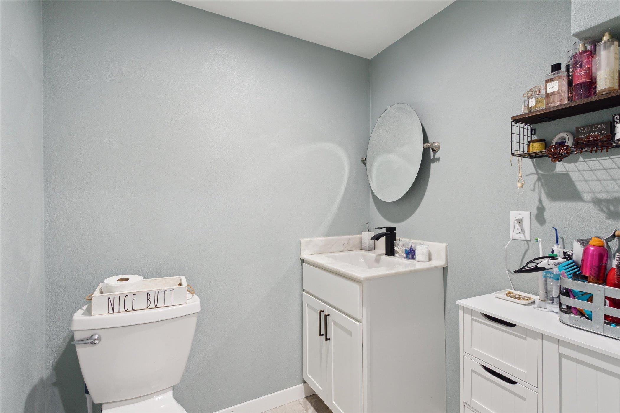 505 East State Line Road Orangeville, IL 61060 - Photo 31 of 58 a bathroom with a sink toilet and a mirror