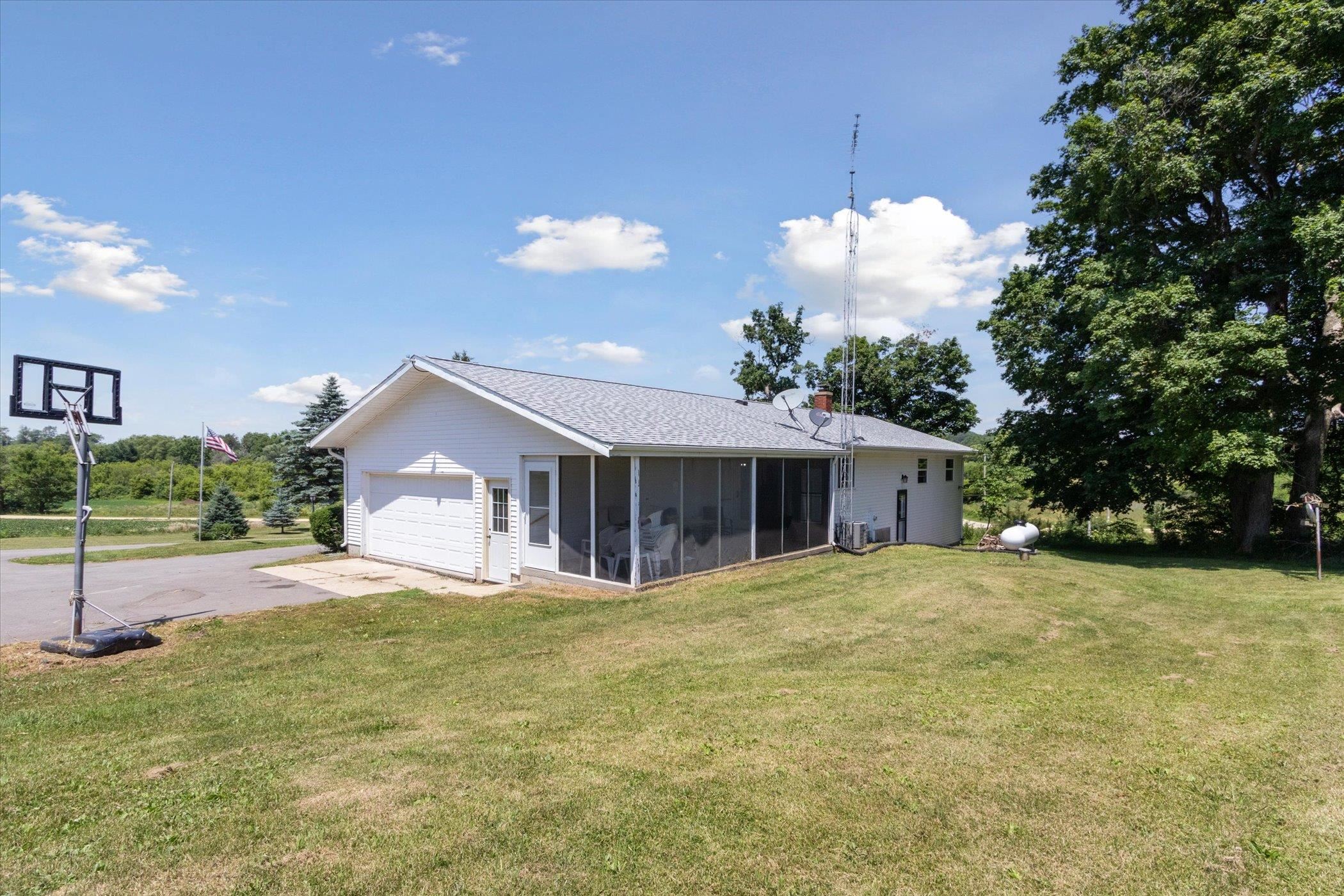 505 East State Line Road Orangeville, IL 61060 - Photo 37 of 58 a view of a house with a yard and potted plants