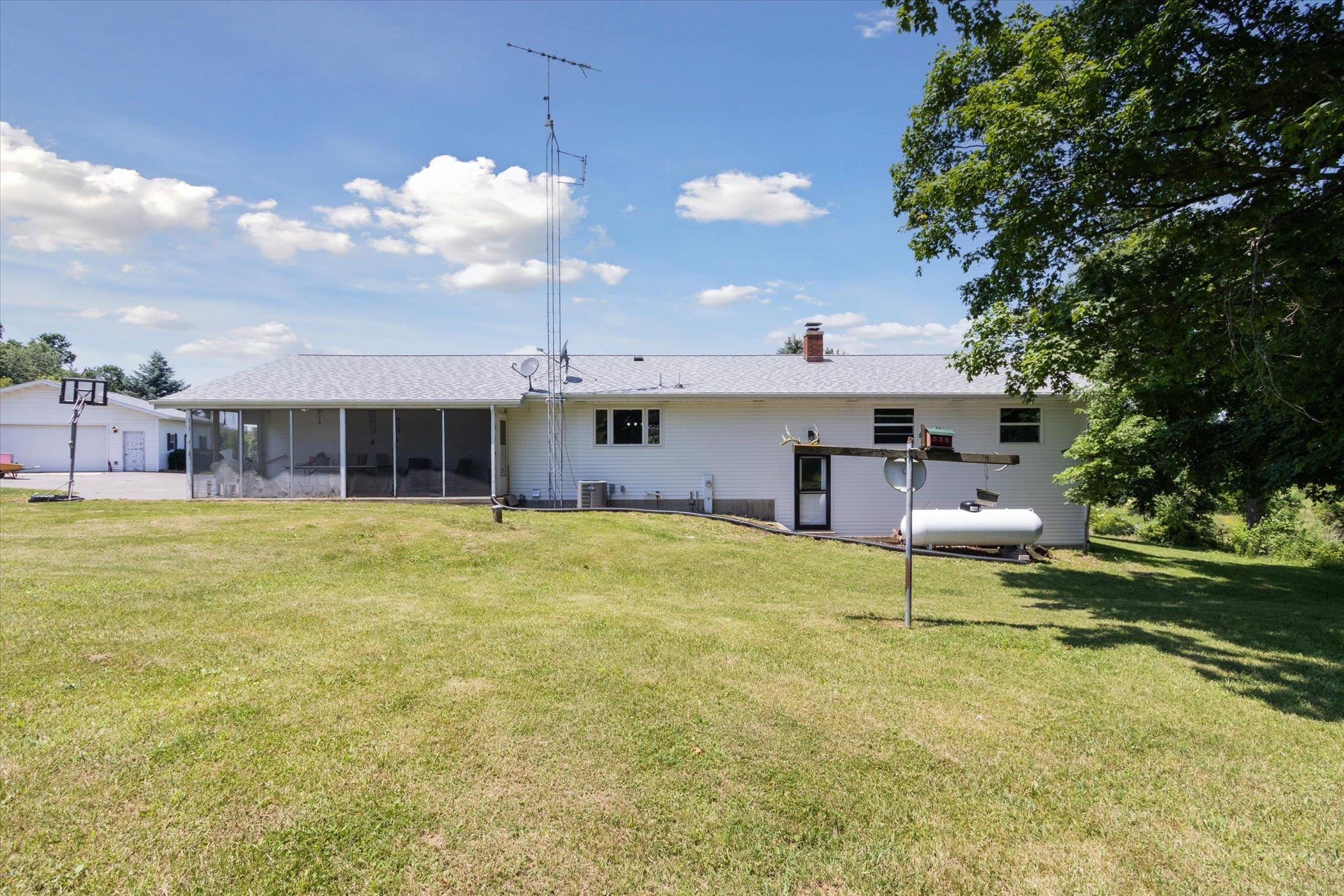 505 East State Line Road Orangeville, IL 61060 - Photo 38 of 58 a front view of a house with swimming pool having outdoor seating