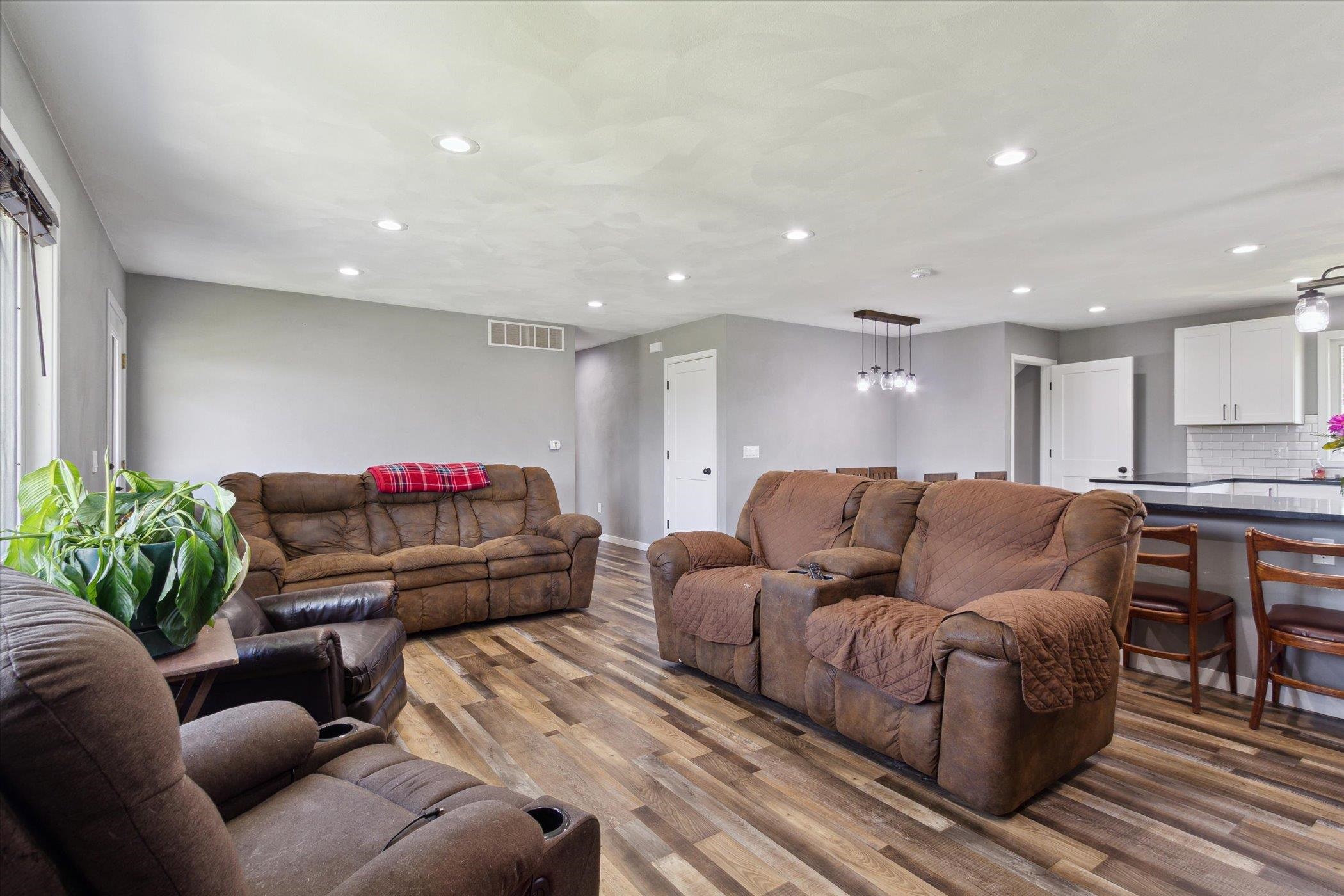 505 East State Line Road Orangeville, IL 61060 - Photo 8 of 58 a living room with furniture a couch and a potted plant