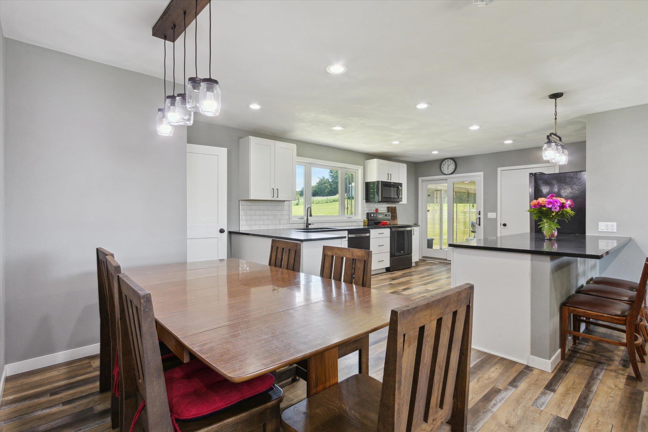 505 East State Line Road Orangeville, IL 61060 - Photo 9 of 58 a view of a dining room with furniture and wooden floor