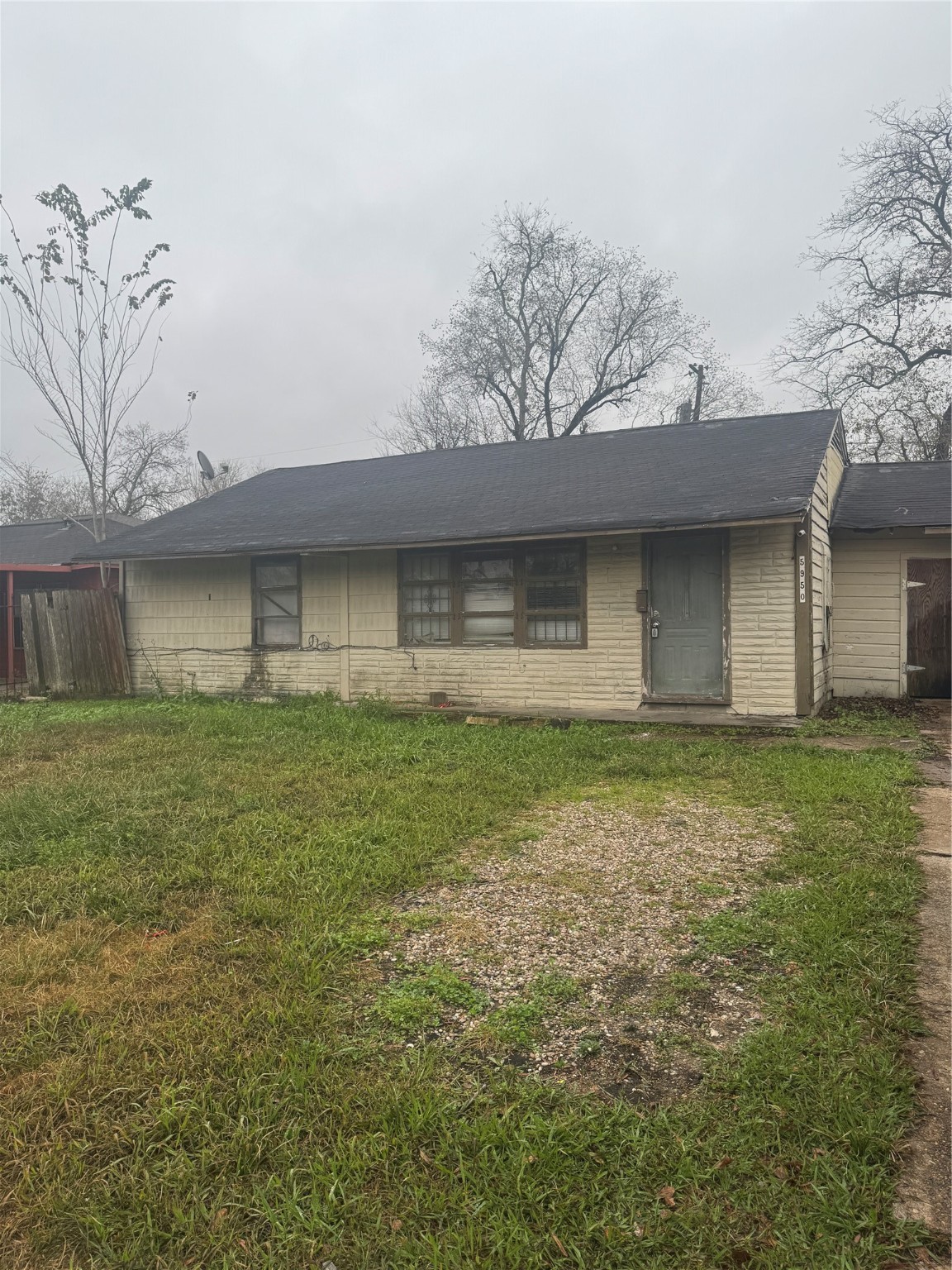 5950 Doolittle Boulevard Houston, TX 77033 - Photo 2 of 25 a front view of a house with a garden