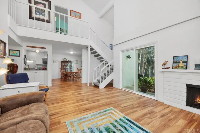 a view of living room and wooden floor