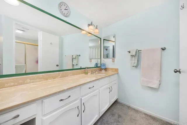 a living room with furniture and a pool table