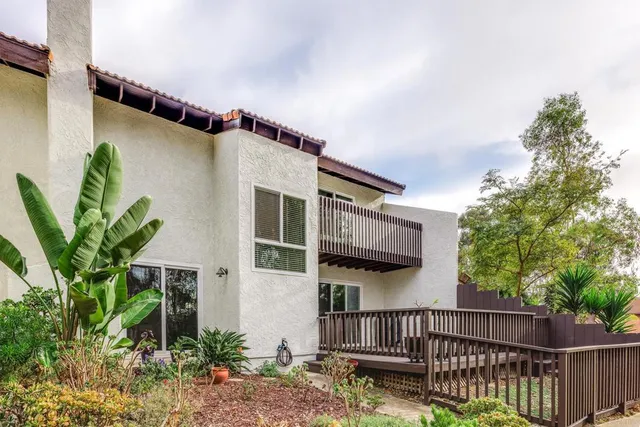 a view of balcony with wooden floor