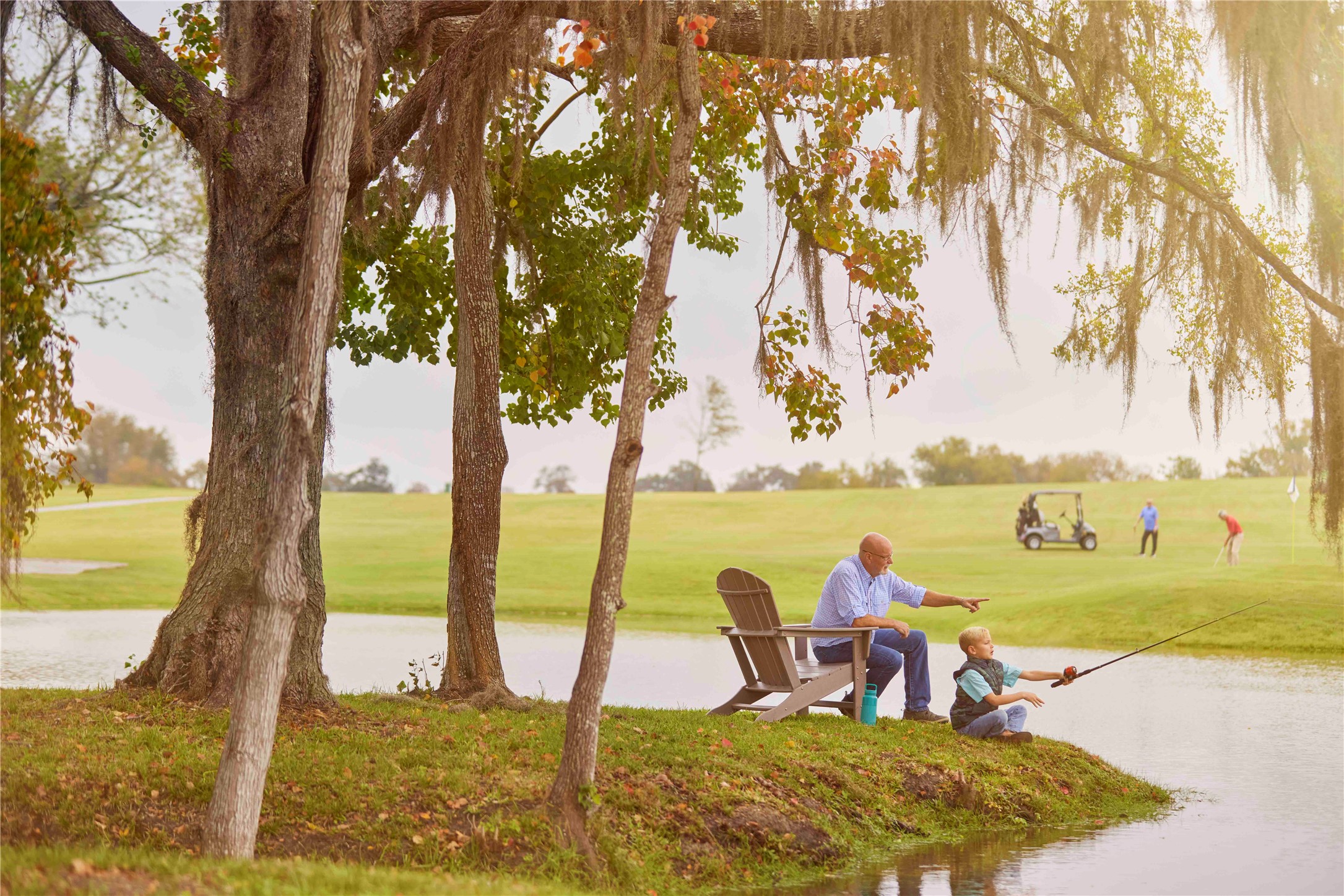 14114 Ripple Rdg Drive Willis, TX 77318 - Photo 7 of 12 a view of a lake with a table and chairs