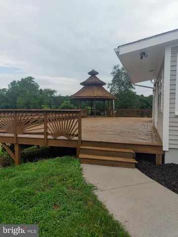 wooden floor in an empty room with a fireplace