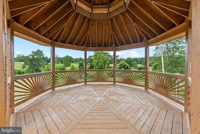 a bathroom with a double vanity sink a mirror and a bathtub