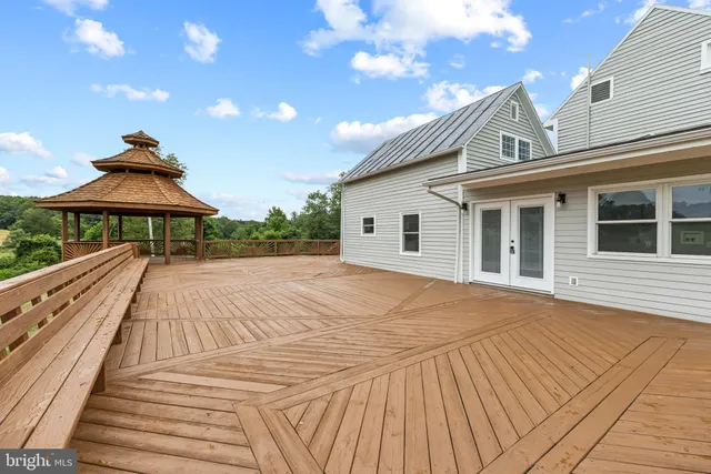 a kitchen with a refrigerator and white cabinets