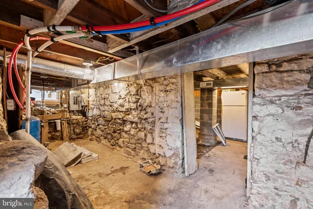 a kitchen with granite countertop a sink counter top space stainless steel appliances and a window