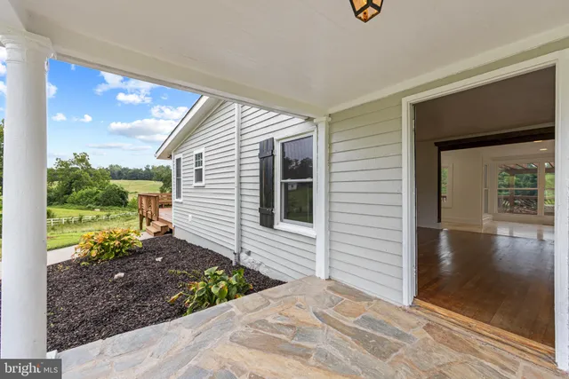 a kitchen with a sink a microwave and window