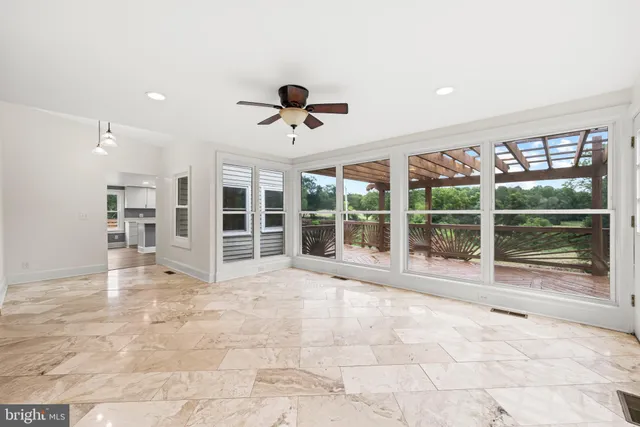 a bathroom with a toilet a sink and a mirror