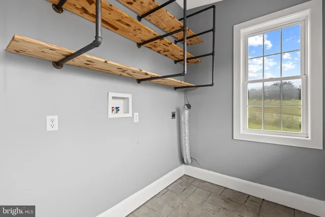 a view of deck with furniture and a table and chairs under an umbrella with wooden floor