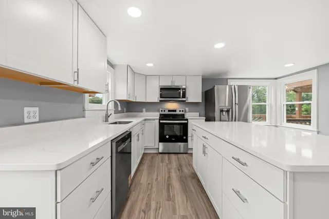 a bedroom with a bed and a wooden floor