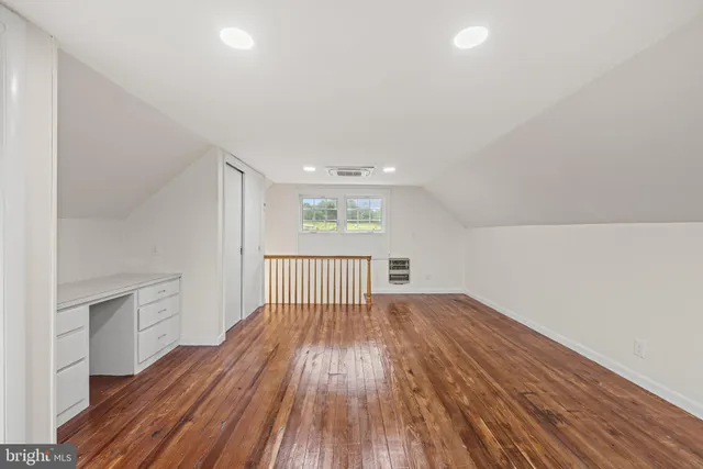 a view of a patio with table and chairs potted plants with wooden floor