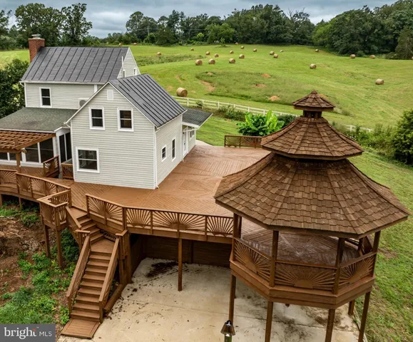 a front view of a house with a big yard