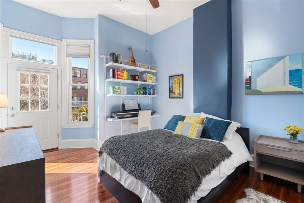 232 West Canton Street, Unit 2 Boston, MA 02116 - Photo 11 of 23 a bedroom with a bed and wooden floor