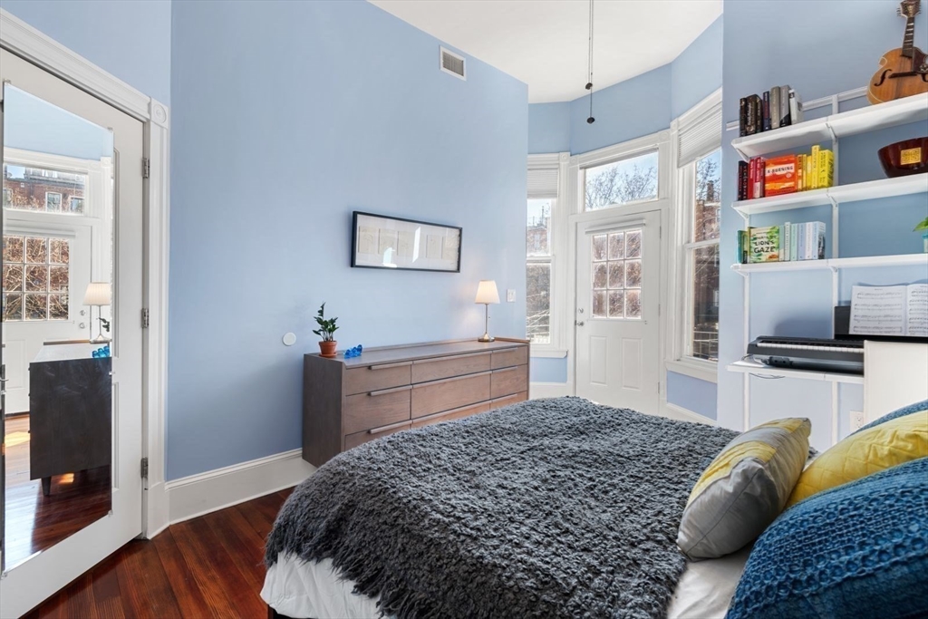 232 West Canton Street, Unit 2 Boston, MA 02116 - Photo 12 of 23 a bedroom with a bed and a television