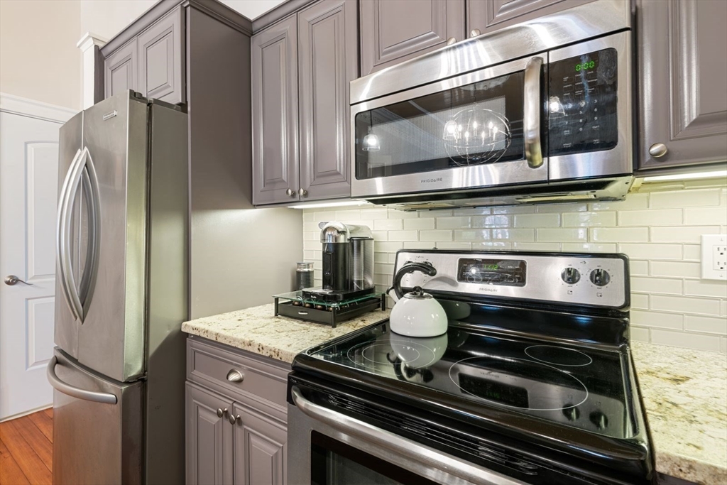 232 West Canton Street, Unit 2 Boston, MA 02116 - Photo 7 of 23 a kitchen with a stove and a microwave