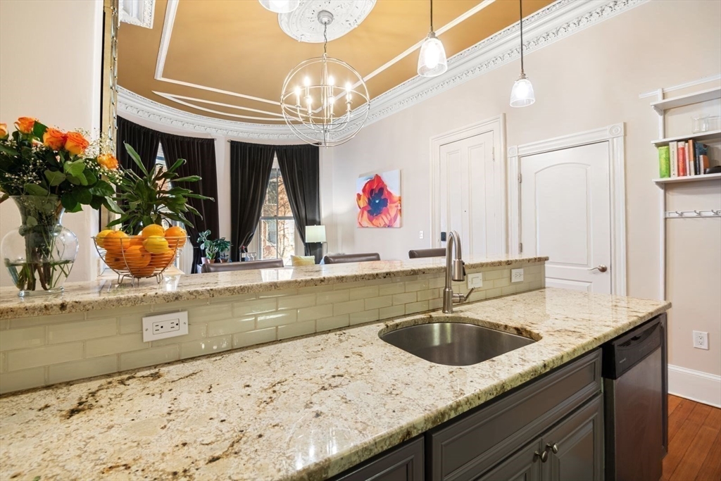 232 West Canton Street, Unit 2 Boston, MA 02116 - Photo 8 of 23 a kitchen with a sink and a chandelier