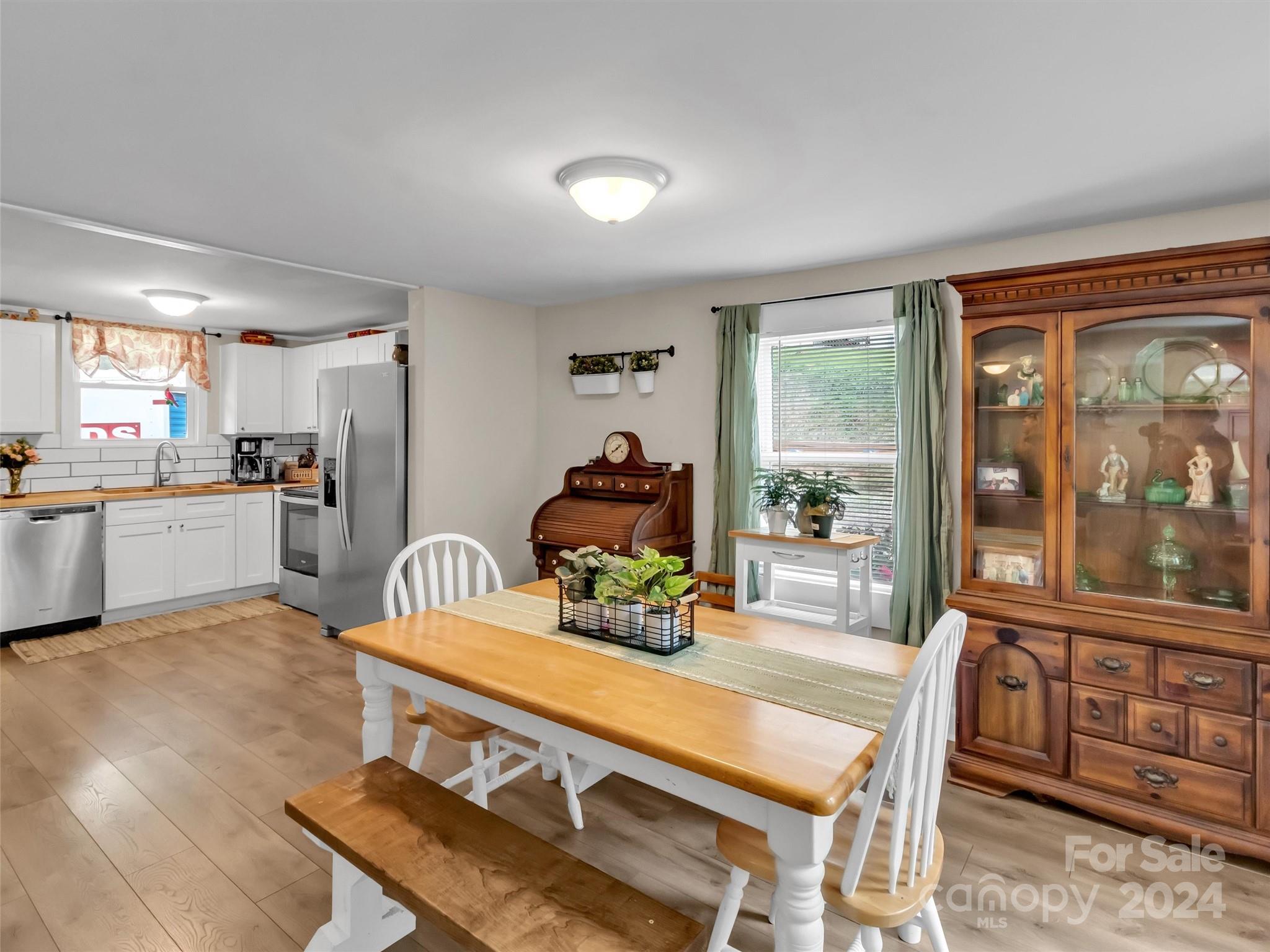 197 Mulberry Street Clyde, NC 28721 - Photo 11 of 20 a view of a dining room with furniture window and outside view