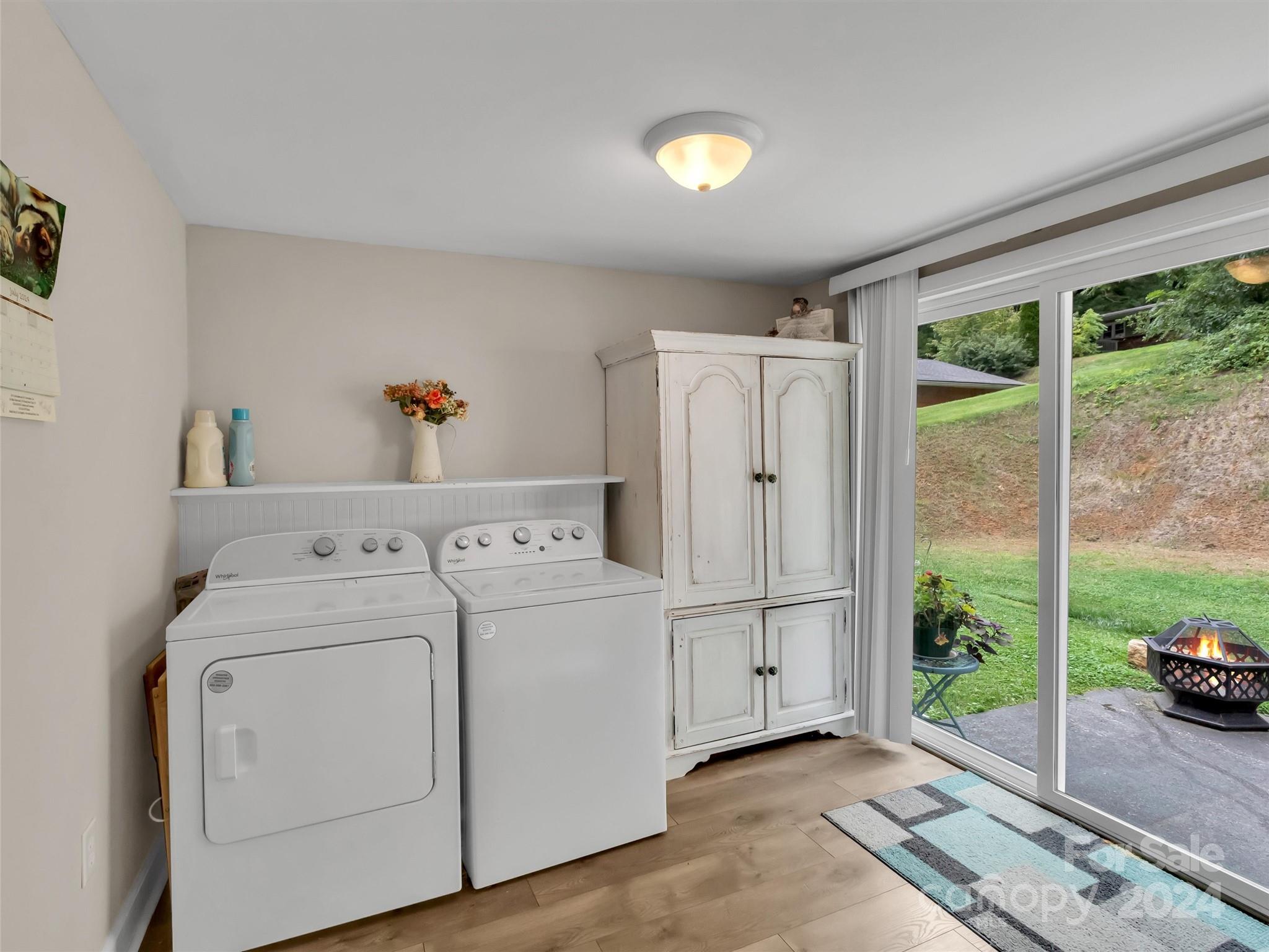 197 Mulberry Street Clyde, NC 28721 - Photo 14 of 20 a utility room with dryer and washer