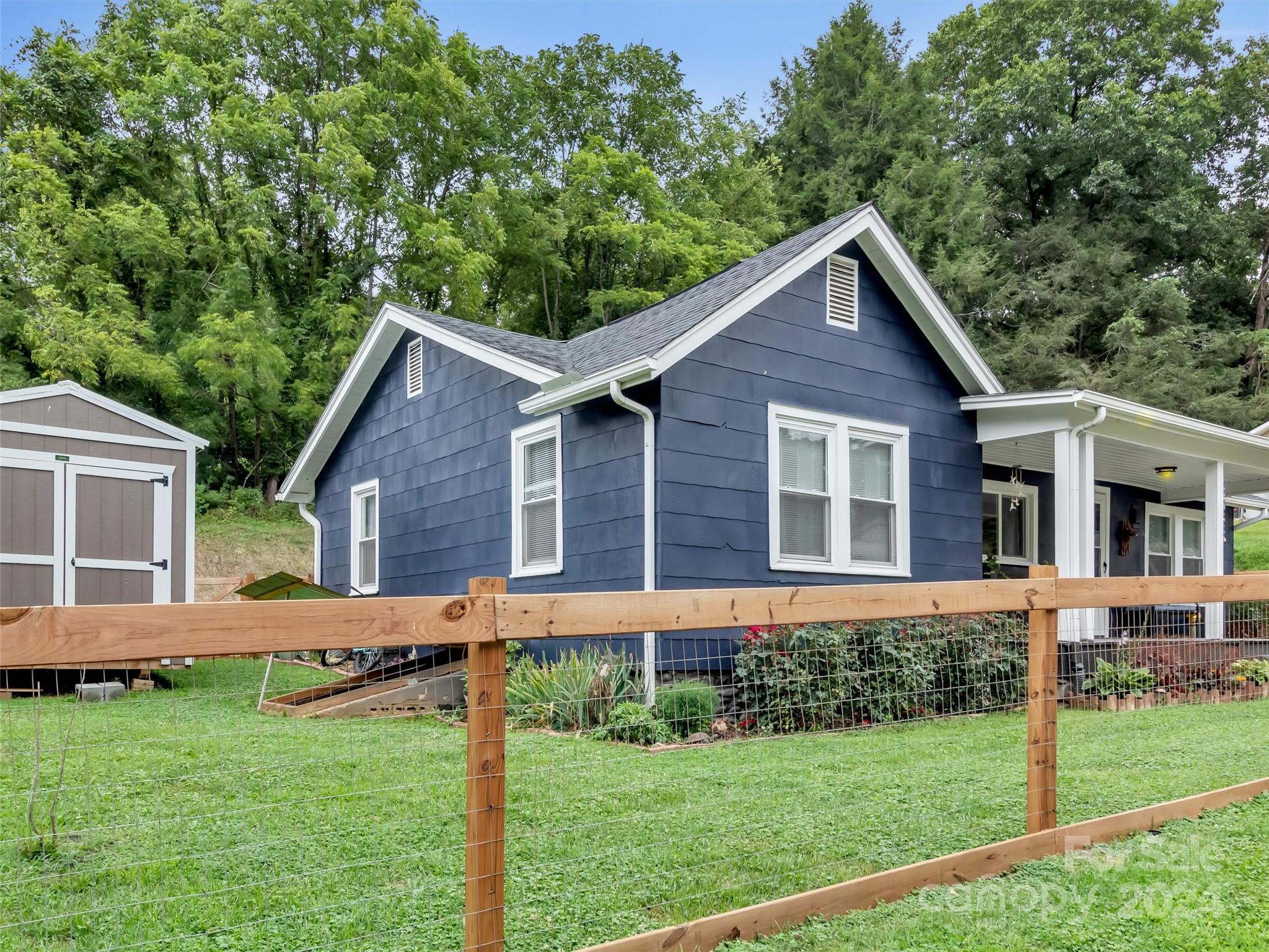 197 Mulberry Street Clyde, NC 28721 - Photo 2 of 20 a view of a house with a yard