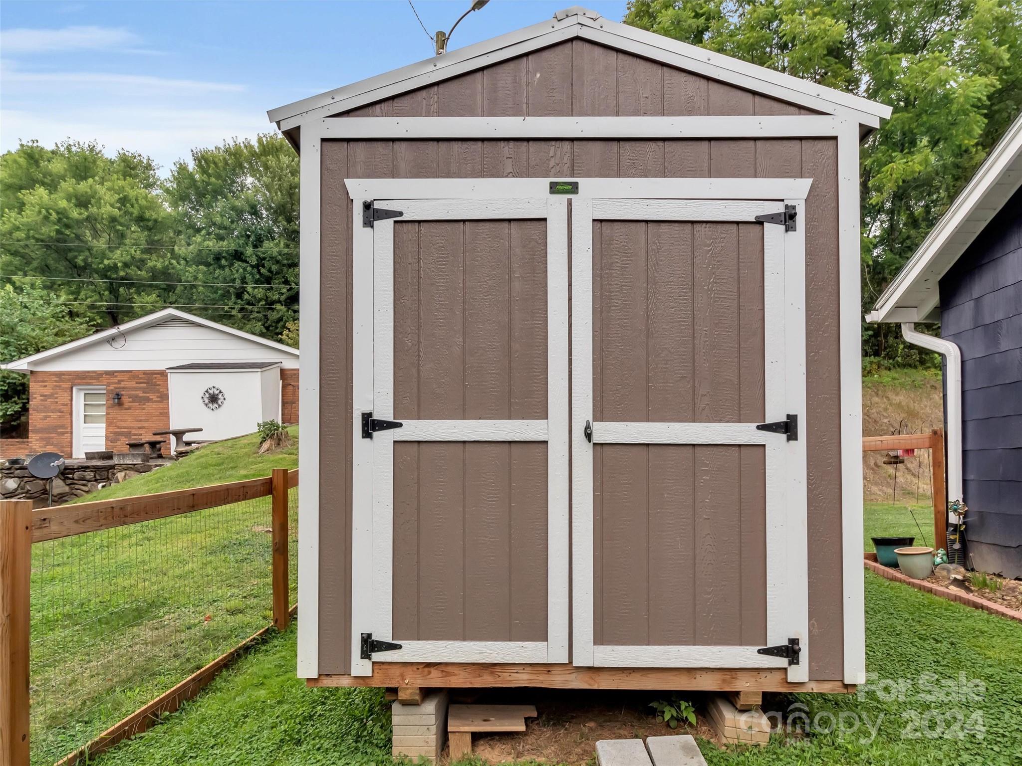 197 Mulberry Street Clyde, NC 28721 - Photo 7 of 20 a front view of a house with garden