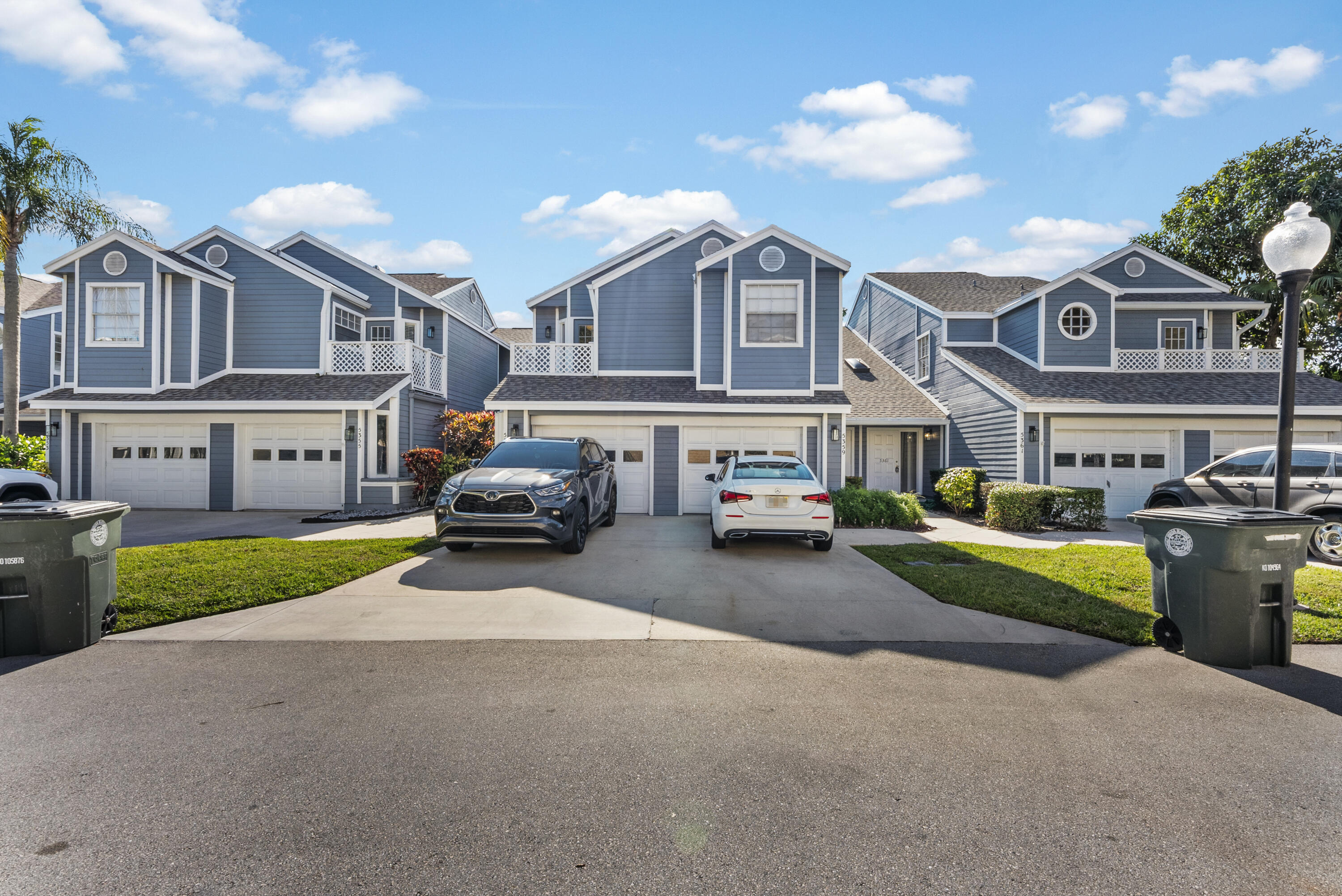 5359 Buckhead Circle, Unit 2031 Boca Raton, FL 33431 - Photo 13 of 25 a couple of cars parked in front of a house