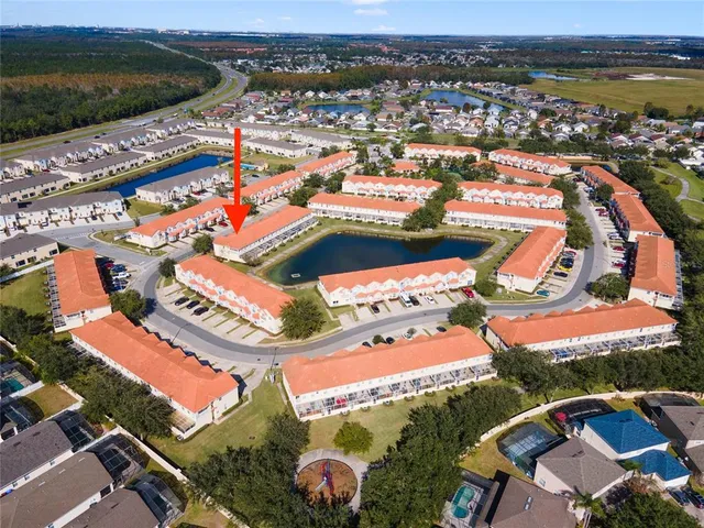 an aerial view of residential houses with outdoor space