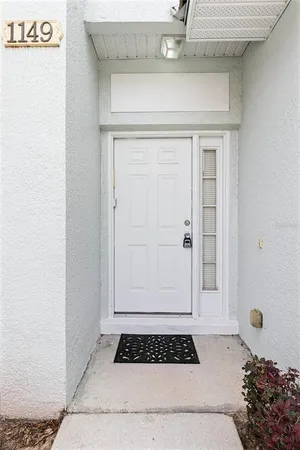 a bathroom with a granite countertop sink and a window