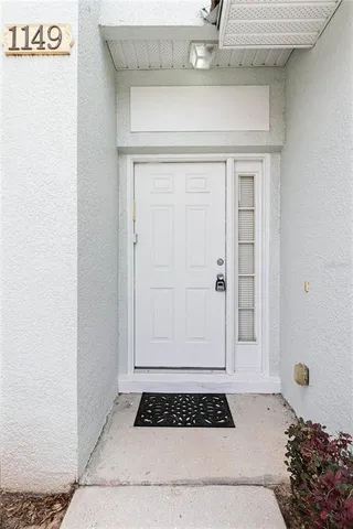 a bathroom with a granite countertop sink and a window