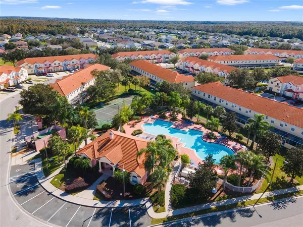 an aerial view of residential houses with outdoor space