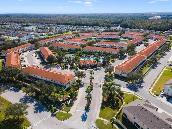 an aerial view of residential houses and outdoor space