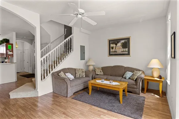 a living room with furniture and a rug