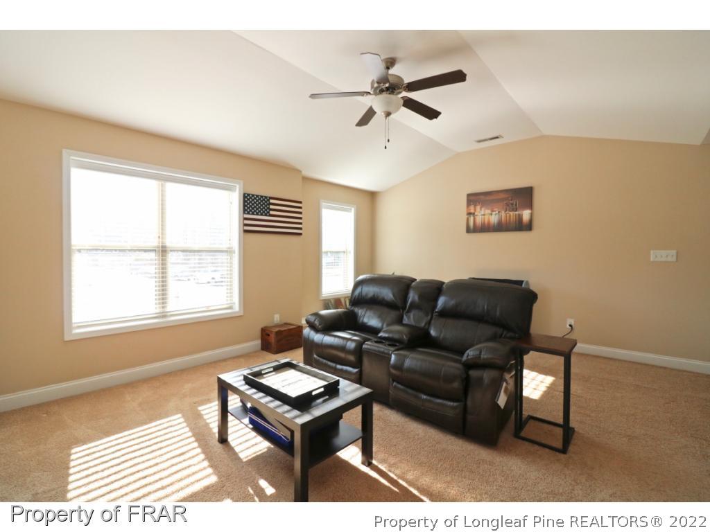 740 Sun Road Aberdeen, NC 28315 - Photo 16 of 36 a living room with furniture and a window